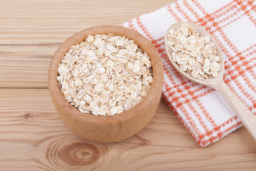 Wooden plate with cereal.
