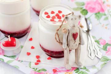 A Jar of Yoghurt with Raspberry Jam and a Teddy Bear Toy