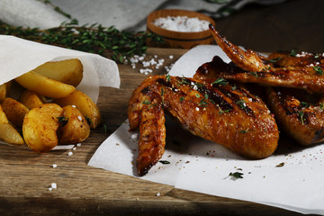 Grilled chicken wings with baked potatoes