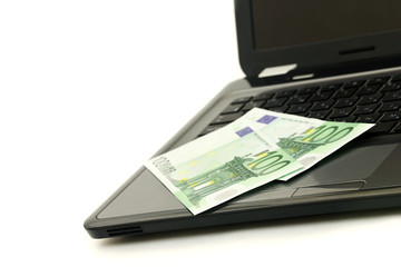Euro banknotes on a keyboard