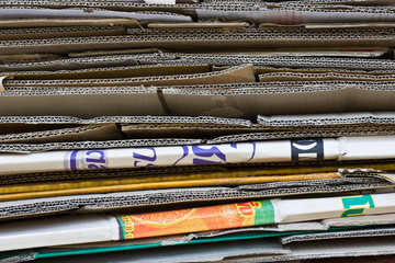 Old record carton covers stacked in pile