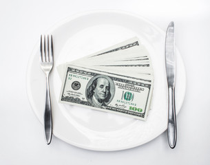 American US dollars in the white plate.