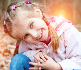 Cute little girl  on the wood