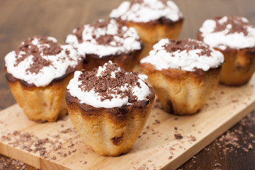 Cupcakes semolina with raisins, protein cream and chocolate.