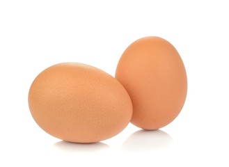 Fresh brown eggs on a white background