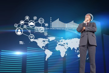 Composite image of thoughtful businessman holding pen to chin