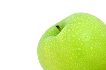 Fresh green apple with water drops on its skin