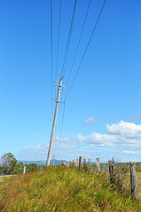 Old wooden electricity post in the countryside
