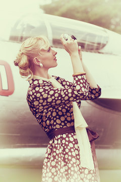 Vintage photo of beautiful girl and plane