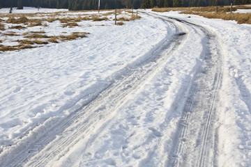 Fototapeta premium frozen winter asphalt road with snow