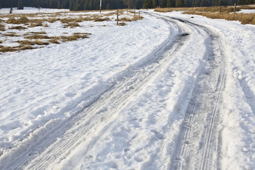 frozen winter asphalt road with snow