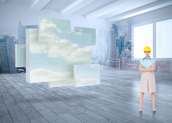 Fototapeta premium Composite image of serious pretty architect posing