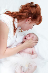 Mom soothes a crying baby