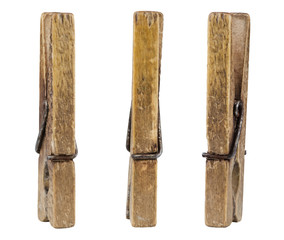 Three old wooden pegs