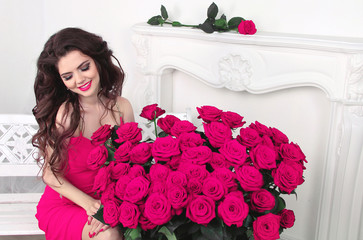 Happy smiling brunette girl with pink roses bouquet, Valentines