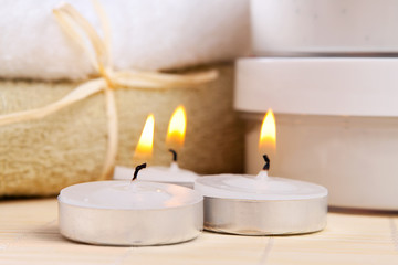 Fototapeta na wymiar spa therapy: three burning candles