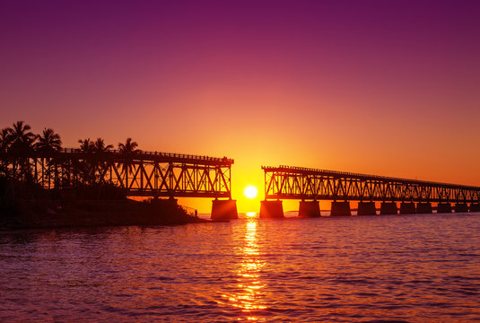 Colorful sunset at broken bridge