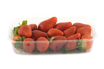 Ripe strawberries in container front view isolated closeup