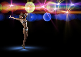 Fototapeta na wymiar woman in bikini and hat dancing