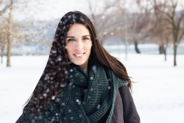 Beautiful girl covered in snowflakes