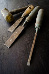 set of carpenter tools on wood background