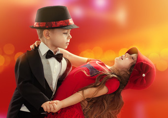Lovely little boy and girl dancing