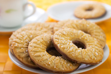 Cookies on plate with coffee cup