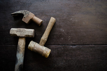 set of hammer on wood background