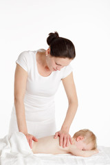 Obraz na płótnie Canvas Massage therapist with her little patient.