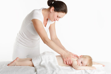 Obraz na płótnie Canvas Massage therapist with her little patient.