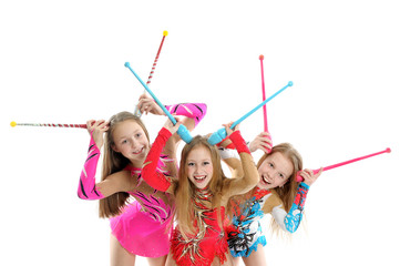 Happy sporty children with gymnastic clubs