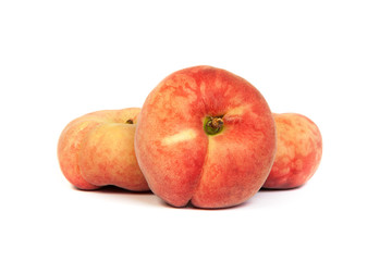 Three ripe fig peach on white