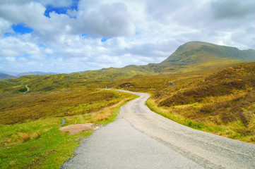 Highlands of Scotland narrow road landscape, Uk