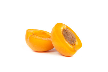 Two ripe apricot sectioned by knife