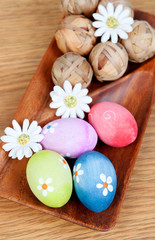 Easter eggs decorated with daisies