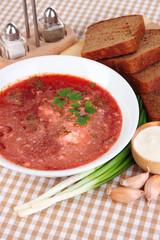 Delicious borsch on table close-up