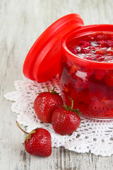 Home made berry jam on wooden table