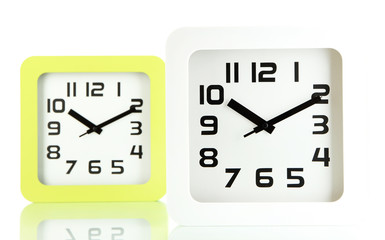 Fototapeta premium Two office clocks, isolated on white