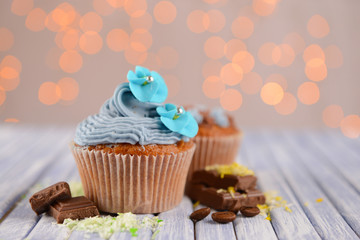 Tasty cupcakes with butter cream,