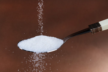 Sugar on brown background