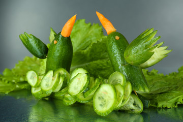 Carving vegetable pattern of hummingbirds on grey background