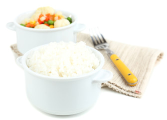 Cooked rice and vegetables isolated on white