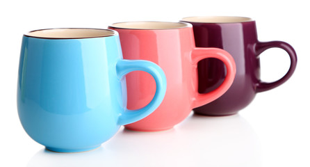 Colorful cups isolated on white