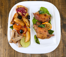 Homemade fried chicken drumsticks with vegetables