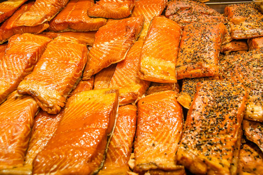 Close-up of smoked salmon for sale at a fish market.