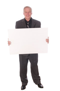 businessman holding billboard advertising will work for whatever, or selling a product billboard
