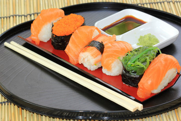 salmon,shrimp,seaweed sushi in the tray