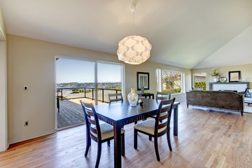 Elegant dining area with walkout deck