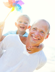 Father and Son Playing on The Beach