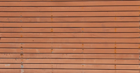 Orange old rusted steel door background, texture